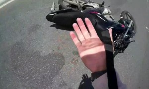 Motorcyclist Distracted by Cat Runs into Large Traffic Cone