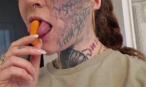 Woman Grabs Carrot With Her Split Tongue
