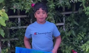 Kid shows off his beautiful hummingbird artwork