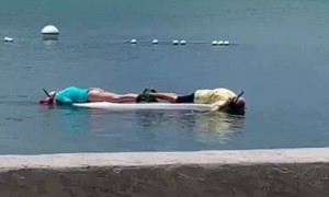 Couple have a romantic snorkeling experience on a SUP