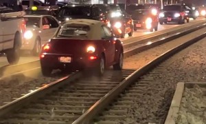 Car Drives Down Train Tracks