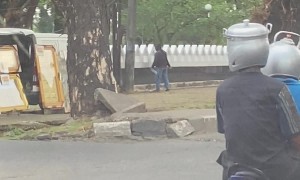 Makassar Motorists Have Helmet Pots