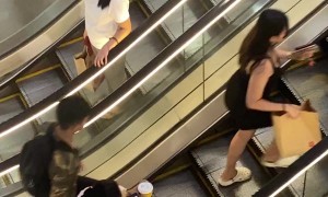Distracted Person Doesn't Realize Escalator Is Stopped