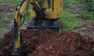 7-Year-Old Helps Dad Plant Trees With Mini Excavator