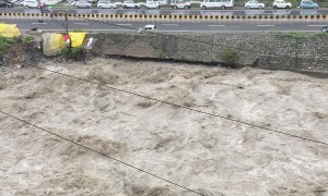 Car Swept Into River by Heavy Rainfall