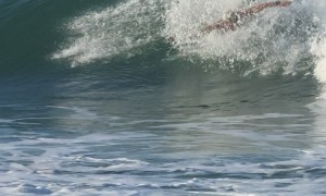 Body Surfer Spins in Wave