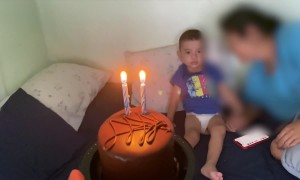 Boy Kicks Birthday Cake