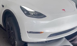 Tesla Driver Runs Over Charging Station and Drags It Away