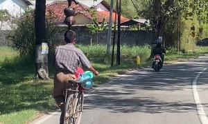 Bike Rider's One-Sided Balancing Act