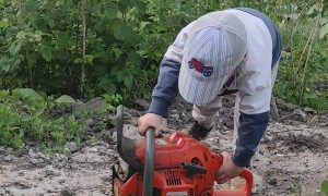 Little Man Frustrated About His Broken Chainsaw