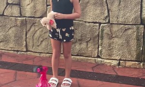 Roller Coaster Soaks Posing Bystander