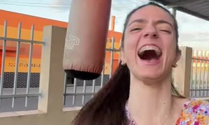 Boxer Slips Kicking Punching Bag