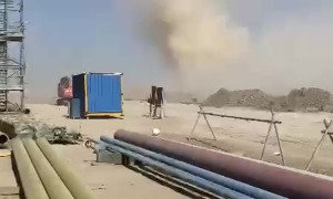 Dust Devil Sweeps Through Worksite