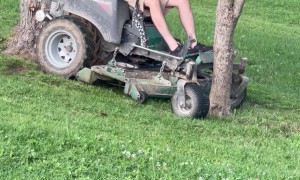Lawnmowing Man Gets Stuck Between Trees
