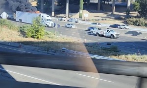 Semi-Truck Full of Monster Trucks on Fire