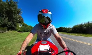 Motorcyclist Hangs On When Hit