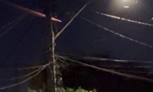 Meteor Streaks Across Night Sky