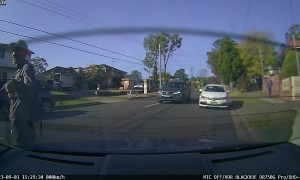 Inattentive Driver Collides With Parked Car