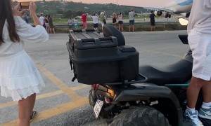 Airliner Takeoff Sends Helmet Flying