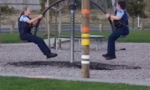 Cops take a break to play on playground