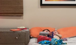 Big Brother Lovingly Pretends To Read To Sister