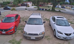 Car Plows Through Garbage Bins