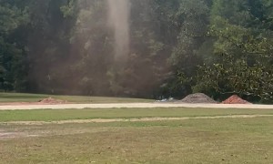 Long-Lived Tall Dust Devil In The Yard