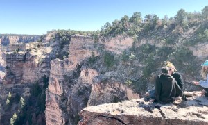 Tourists Hop Over Railing at Grand Canyon