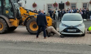Locals Take Matters Into Their Own Hands When Parked Car Interrupts Festival