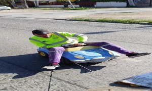 Garbage Man Rides Along on Toy Car