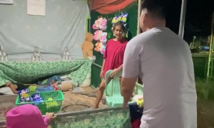 Missed Throw Reveals Someone Sleeping Under Carnival Game