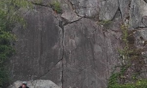 Mountain Biker Rides Vertical Rock Wall