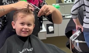 Son Practices His Best Blue Steel During Haircut
