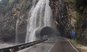 Heavy Rain Creates a Waterfall Over Road