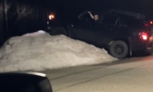 Friend's Car Climbs Snowbank