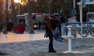 Man Helps His Girlfriend Avoid Sandy Feet