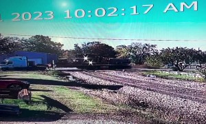 A Trailer And Train Meet On The Tracks