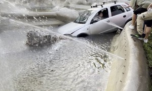 Woman Drives Her Car Into a Fountain