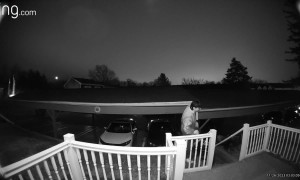 Doorbell Camera Captures Drunk Guy Falling Over Railing