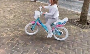 Girl Rides Her Bike Into a Pole