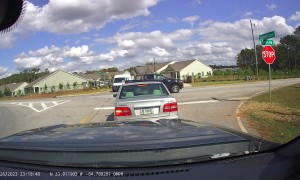 Turning Car Collides With Postal Van