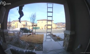 Man Falls From Roof and Deftly Rolls Into His Landing