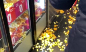 Swinging Door Spills Popcorn