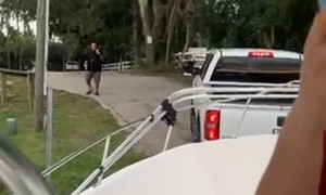 Truck Follows Boat Into Water
