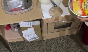 Girl Gets Cookin' in Cardboard Kitchen