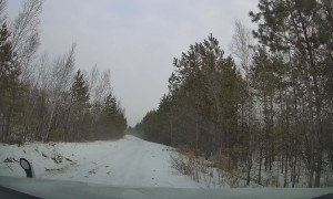 Passing Sledder Unexpectedly Crashes Into Parked Car