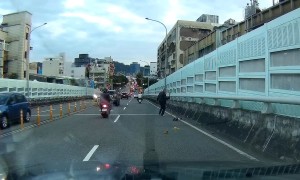 Scooter Man Slips In Traffic