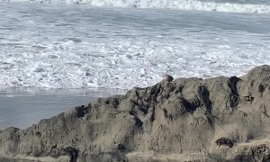 Man Gets Knocked Down By Big Wave