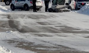 Skid Loader Plows Into Police Cruiser