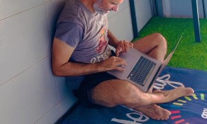 Spider-Dog Walks on Wall While Dad Works